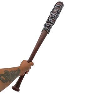 hand holding Dark woodgrain baseball bat with silver barbwire wrapped around top half on white background