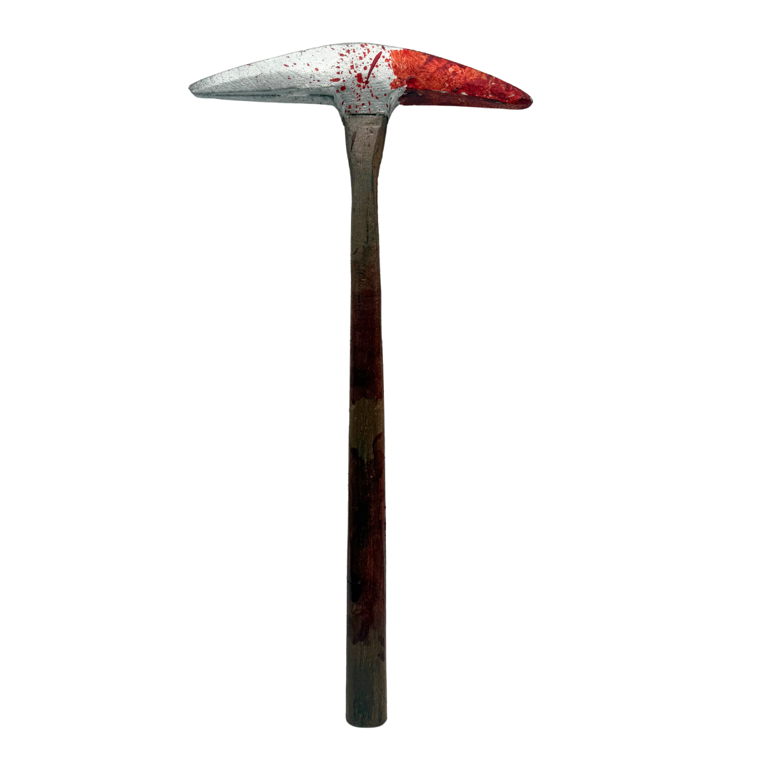 A pickhead hammer with a silver and red splattered head and a dark brown wooden handle, isolated on a white background.