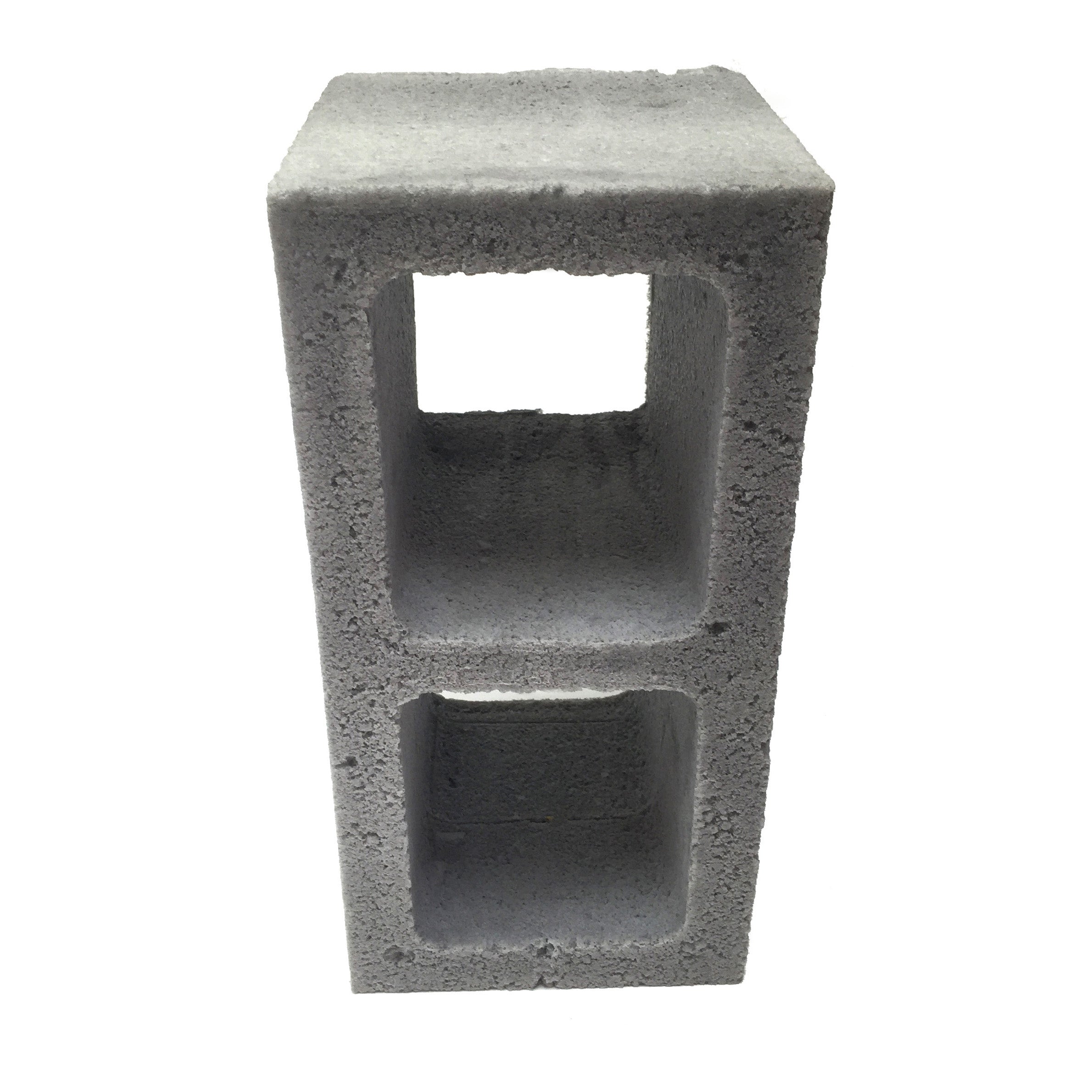 Front view of a realistic flexible foam prop cinder block with a gray stone color and texture, designed for safe use in stunts, theater, or film