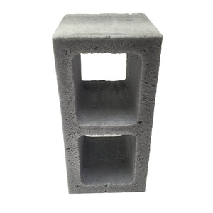 Front view of a realistic flexible foam prop cinder block with a gray stone color and texture, designed for safe use in stunts, theater, or film