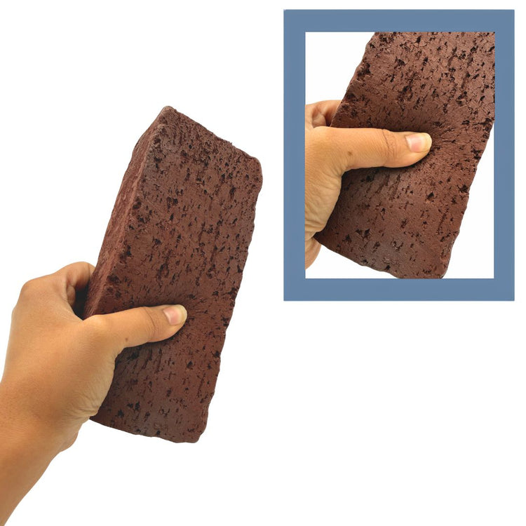 A hand holds a dark brown porous sponge or foam block against a white background, with a blue-bordered inset showing a close-up of the same object being squeezed by a hand.