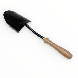 Black garden shovel with a wooden handle on a white background