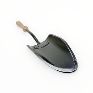 Metal shovel with a wooden handle on a white background