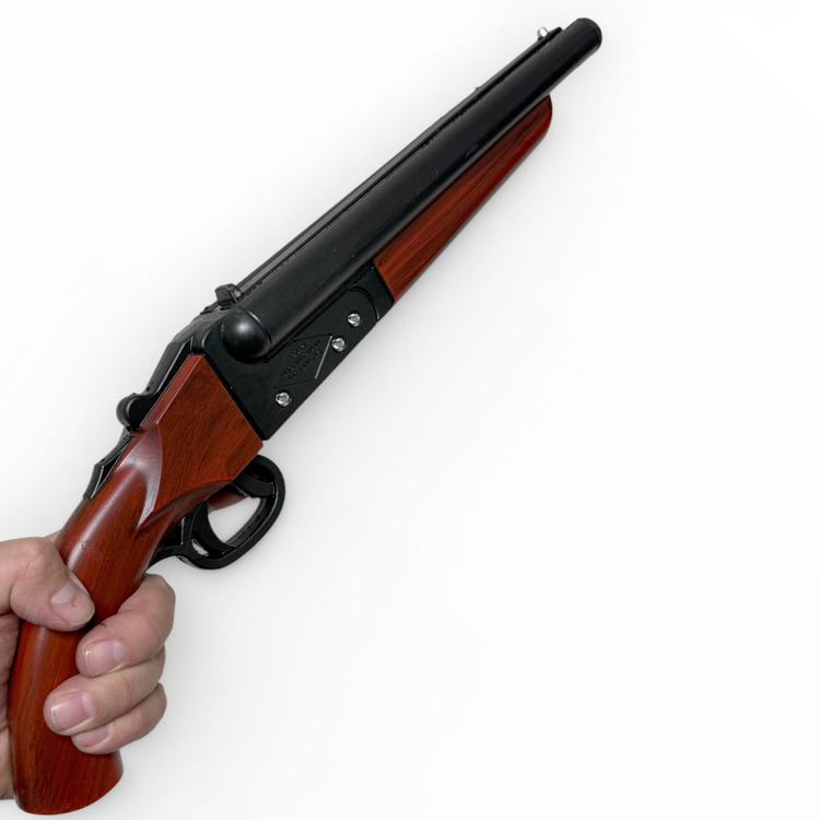 Wooden rifle held by a hand on a white background