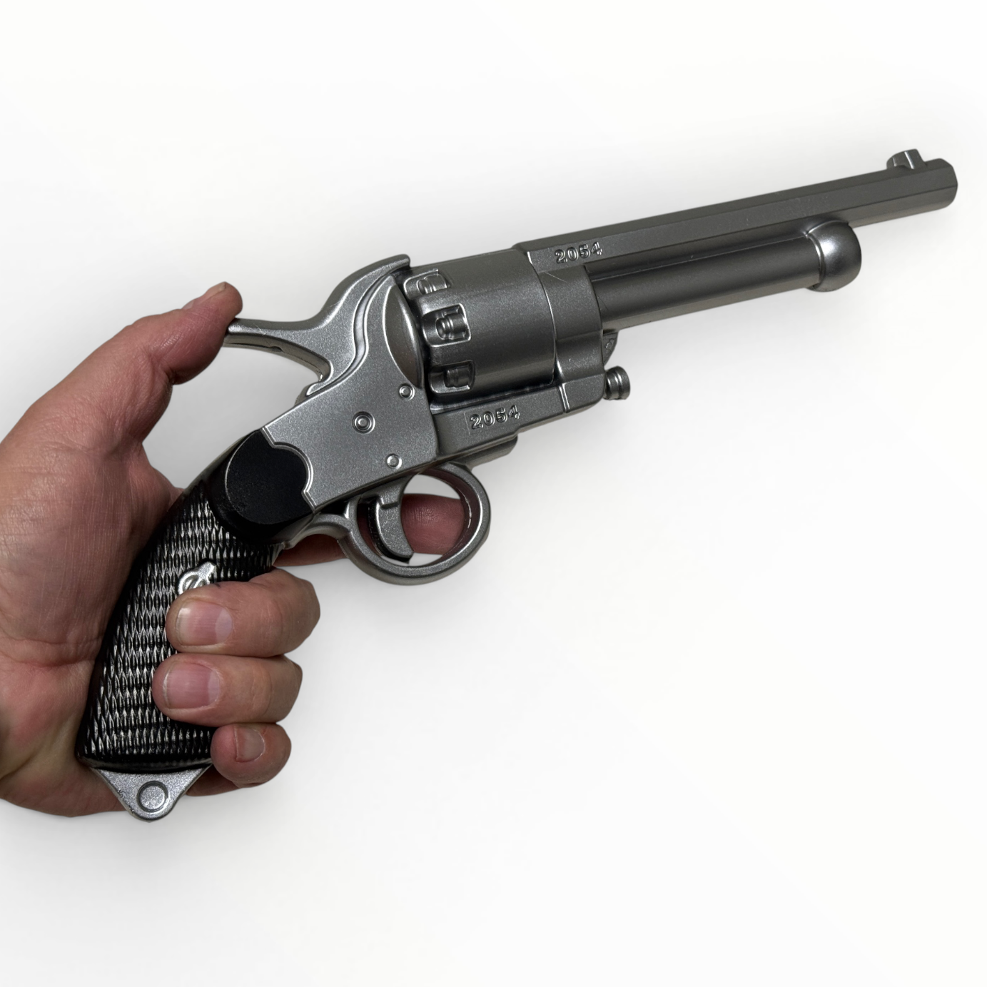 Hand holding a silver revolver on a white background