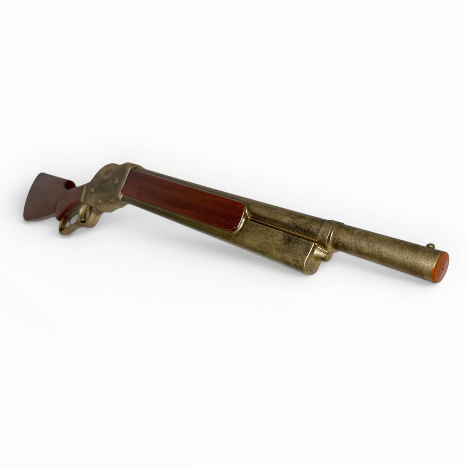 Brass and red object on a white background
