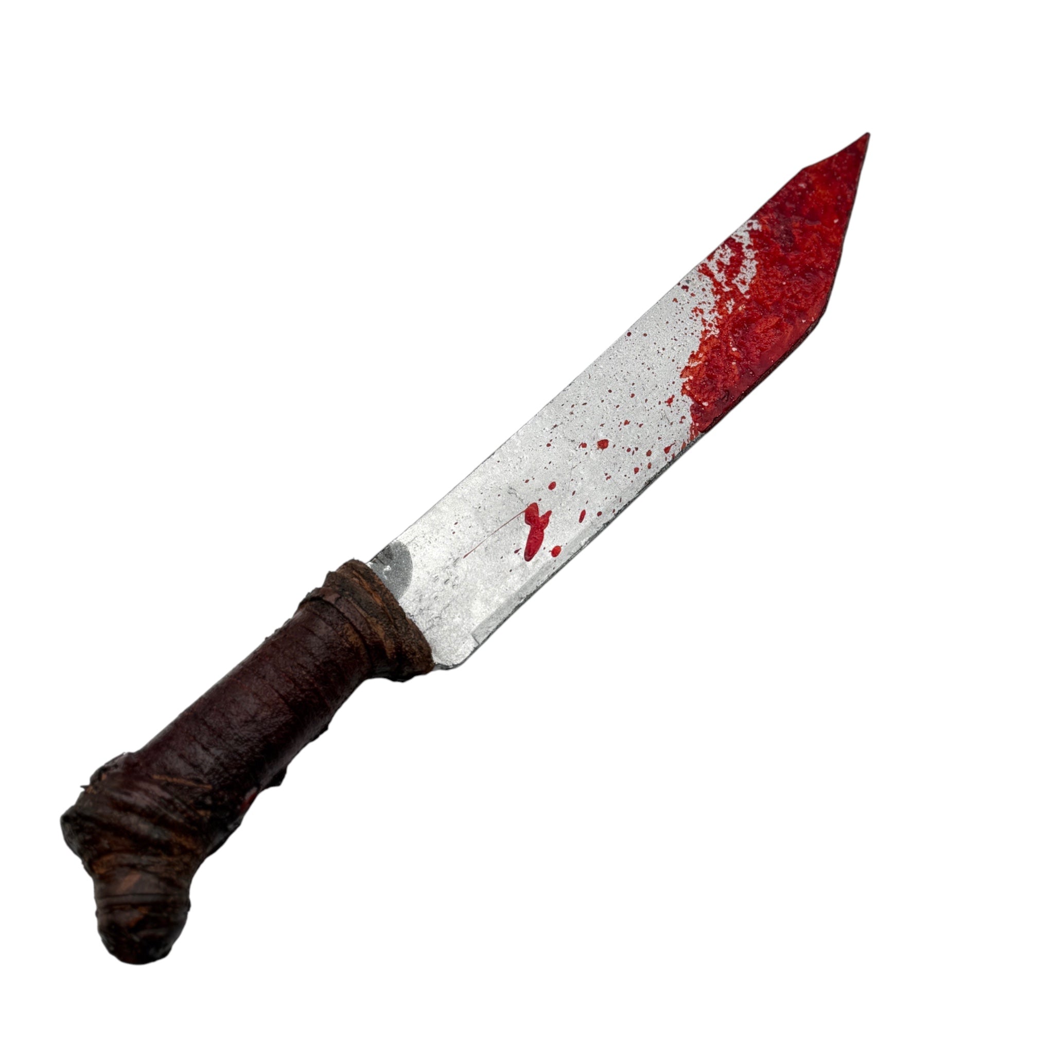A toy or prop knife with a dark brown textured handle and a silver blade splattered with red fake blood, isolated on a white background.