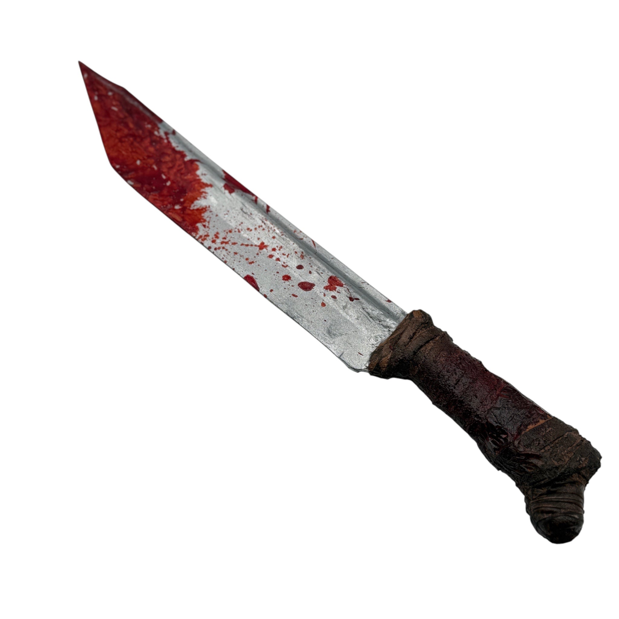 A fake bloody knife prop with a silver blade covered in red fake blood splatters and a dark brown textured handle, isolated on a white background.