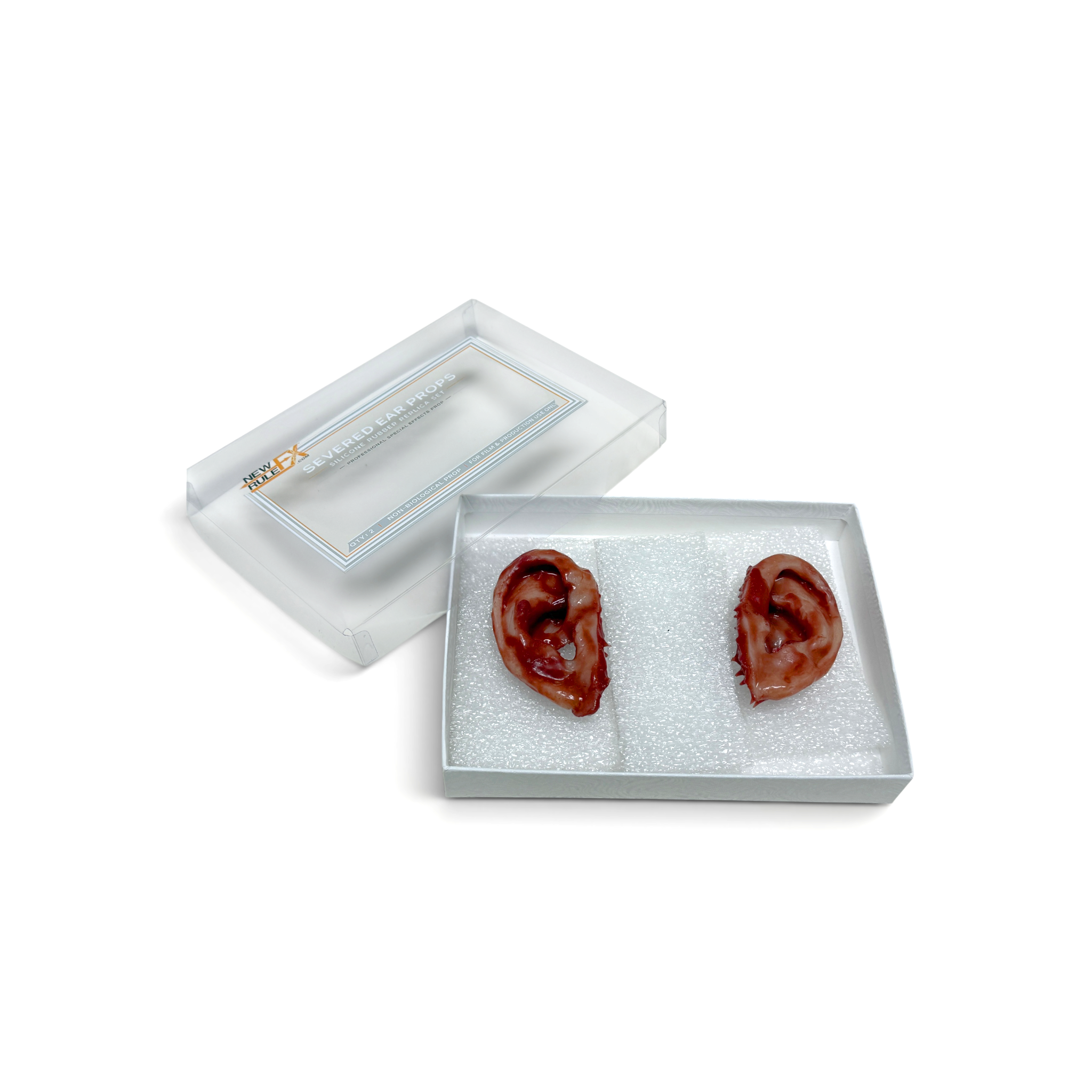 Two red ear-shaped objects in a clear box on a white background