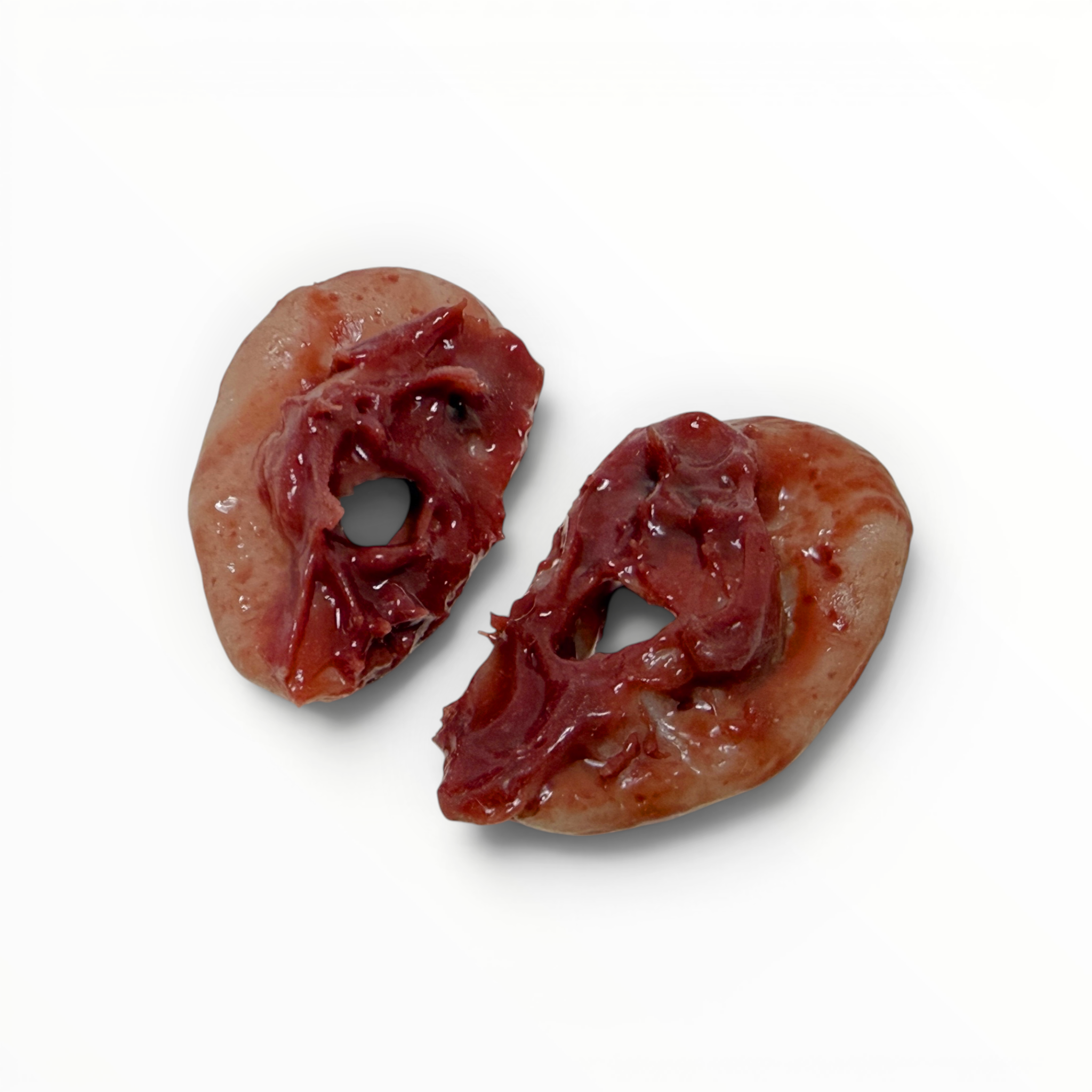 Back view of two fake severed ears on a white background