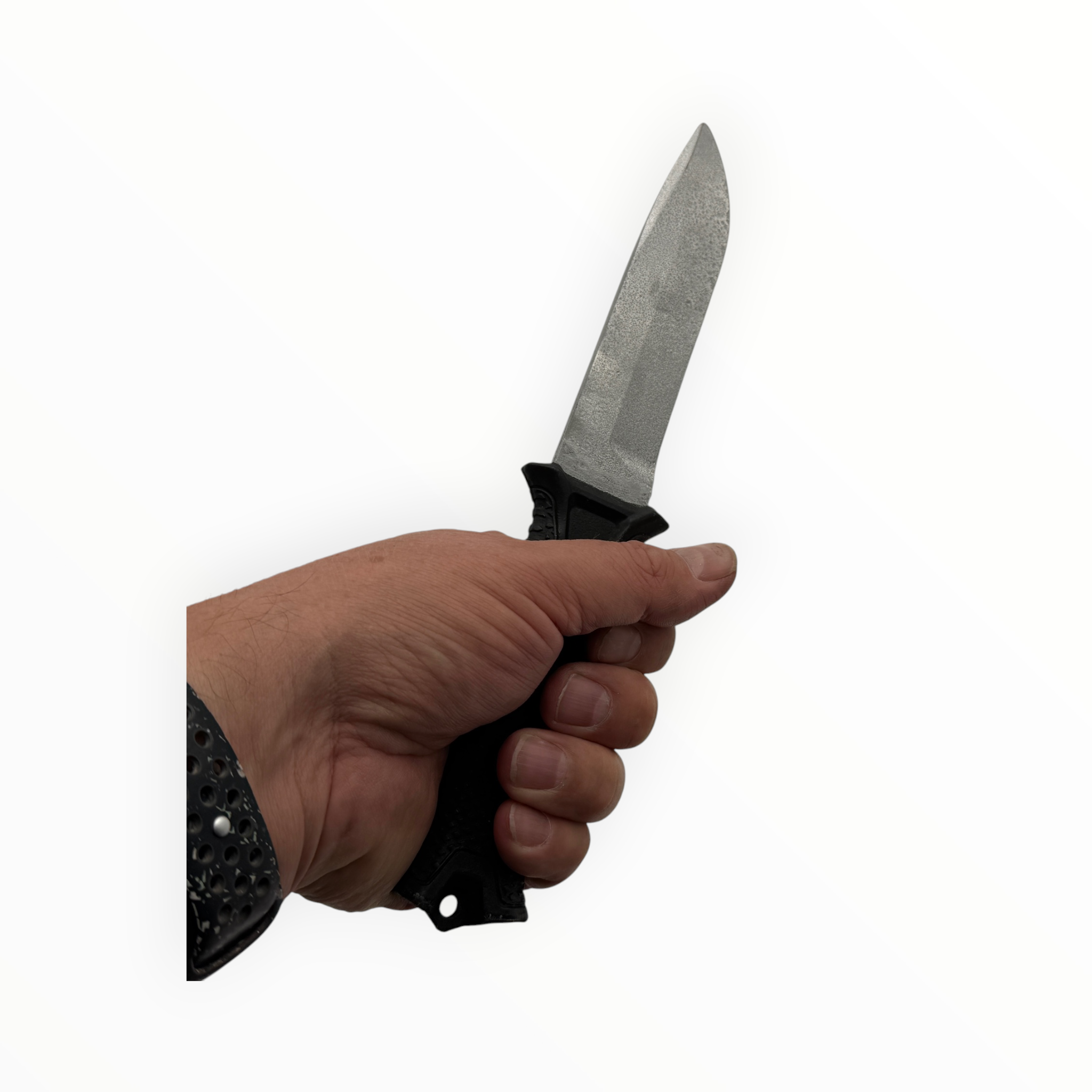 Hand holding a knife with a white background