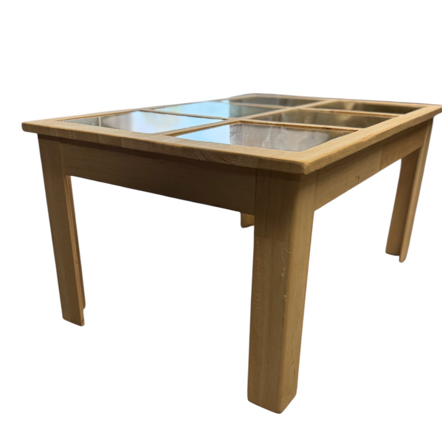 Balsa Wood and Glass Breakaway Coffee Table Smashable Stunt Prop; a light wooden table with six inset glass panels, designed for special effects use.