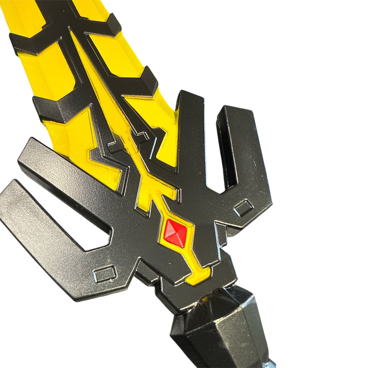 Foam Rubber Magik’s Sword Prop close-up: black angular guard, yellow detailing, red diamond-shaped gem; ideal for kids’ role-play, crafted for realistic special effects.