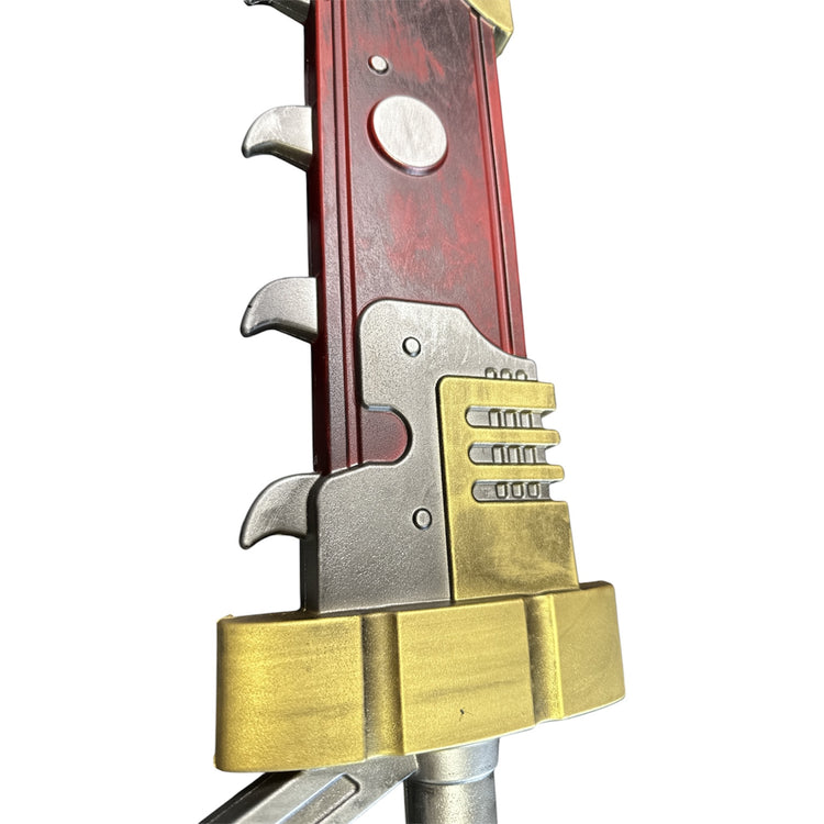 Foam Warhammer Chainsword Imperial Golden Eagle Prop featuring a red grip with silver triggers and a chunky gold guard, ideal for cosplay or theatrical use.