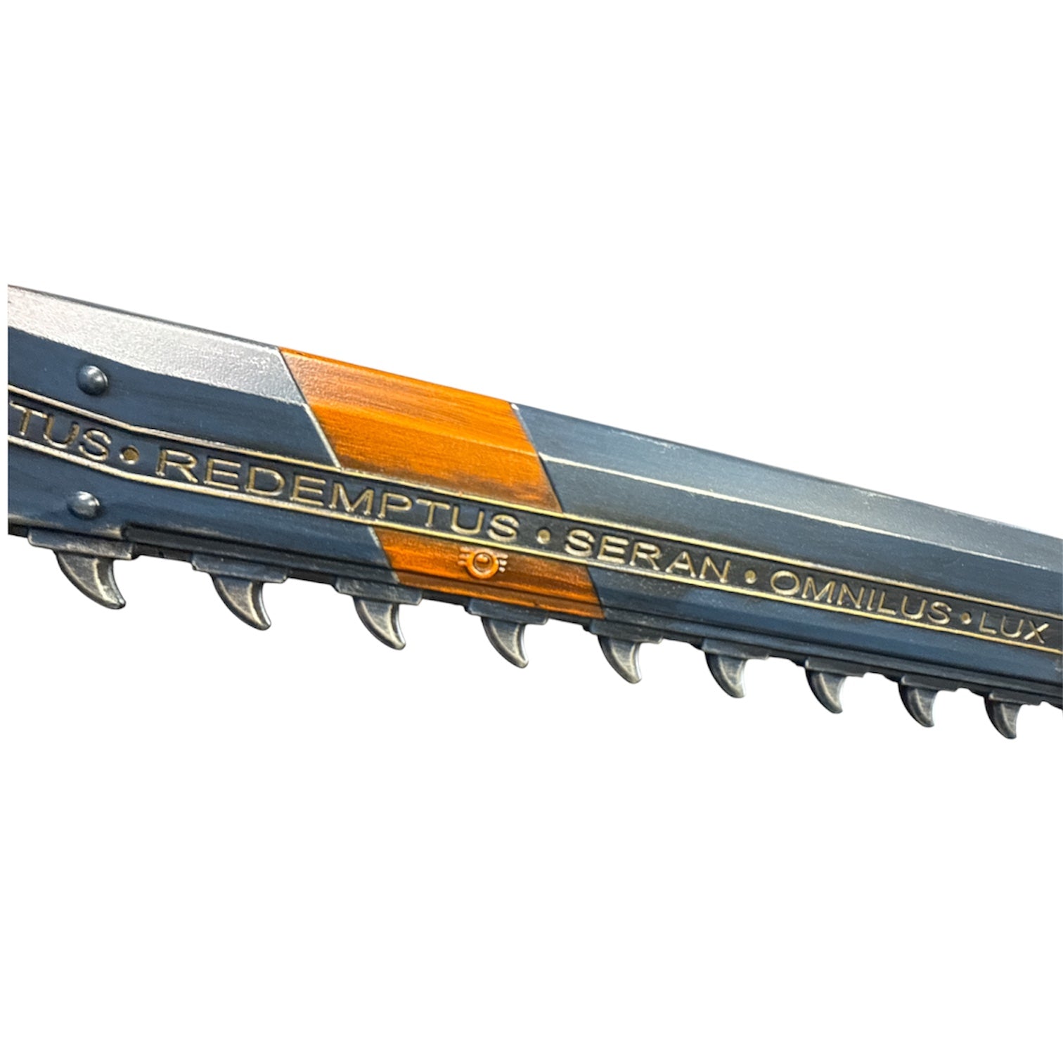 Foam Astartes Chainsword Prop with hooked metal teeth and blocky housing, featuring gold-inlaid lettering REDEMPTUS • SERAN • OMNILUS • LUX, approximately 39.5” long.