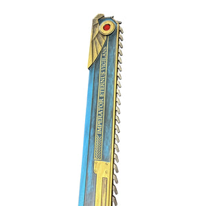 Foam Hell’s Teeth Chainsaw Prop featuring a stylized blue blade with gold trim and teeth, engraved with IMPERATOR ETERNUS VIGILANS, showcasing ornate ceremonial design.