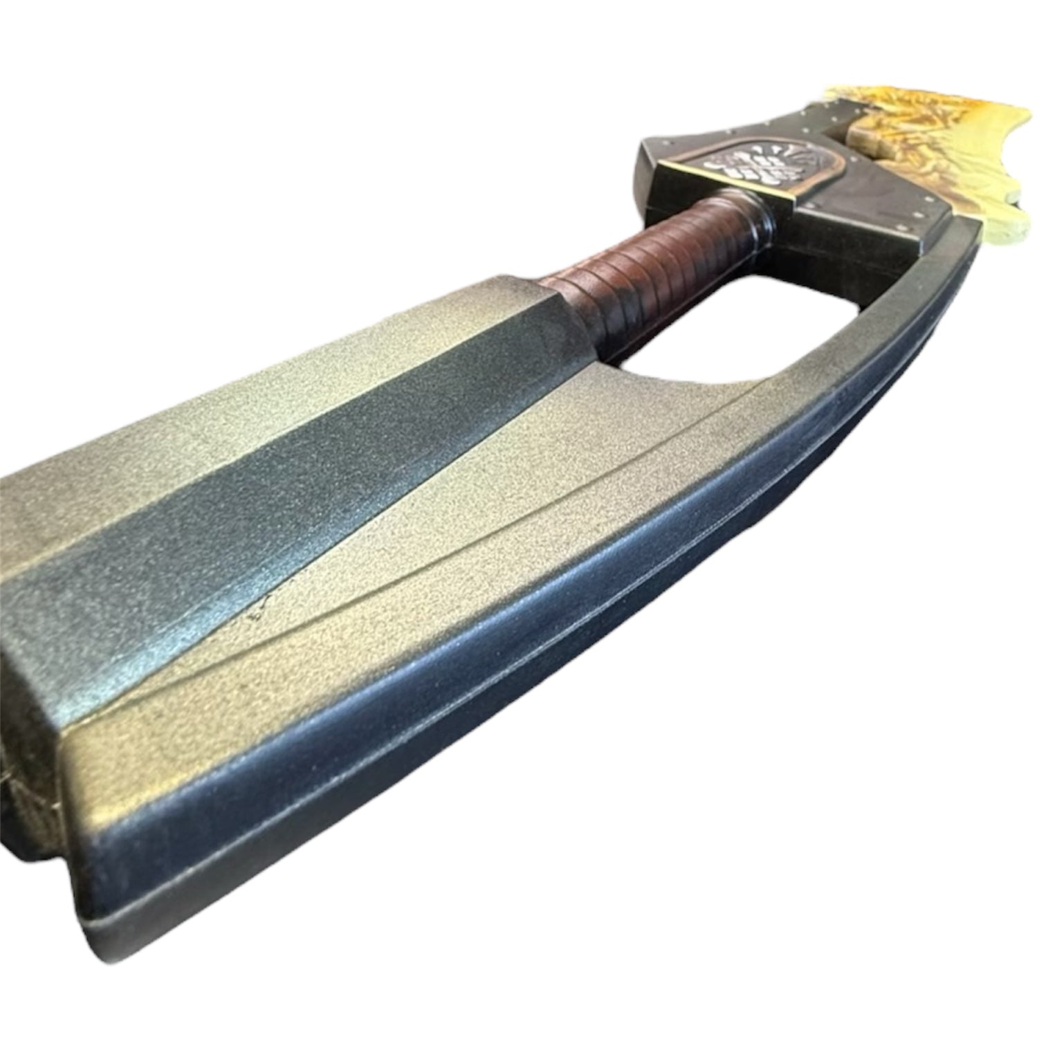 Foam Giant Monster Jawblade Sword Prop with a flame-shaped yellow tip, black blade, and brown-wrapped handle, measuring approximately 47” x 12” x 4”.