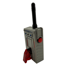 A gray plastic toy walkie-talkie with a black antenna, a red button, and a red translucent speaker, shown on a plain white background.