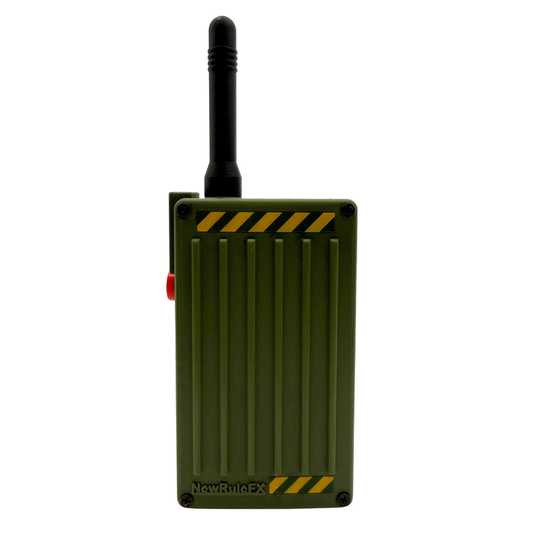 An olive green rectangular electronic device with a black antenna, featuring yellow hazard stripes and a red side button, on a plain white background.